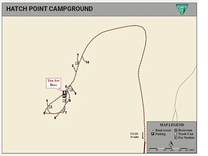 A map of Hatch Point Campground that shows sites 1 through 10 going counter clockwise around the loop. The vault toilets and fee station are on the North end of the loop.