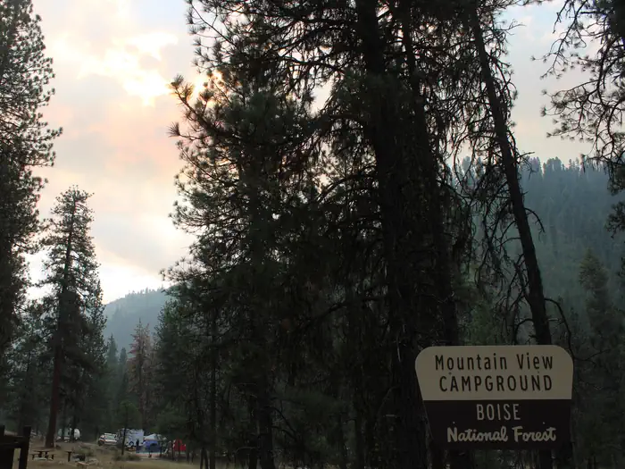Sunshines down behind trees in the mountain view campground