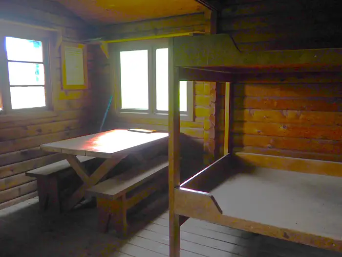 Sergief Island Cabin interior showing wood bunkbed and table