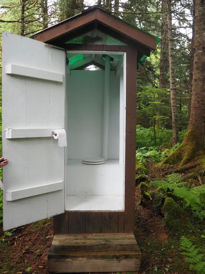 Gut Island 2 Outhouse with door held open