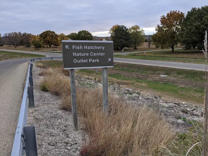 Sign showing directions to the Fish Hatchery, Nature Center and Outlet Park
