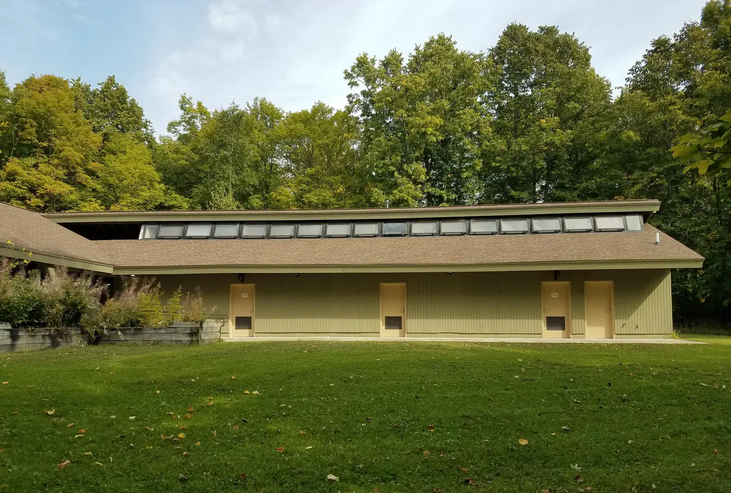 Outside of the Clark Lake pavilion, the wing that houses the restrooms and shower rooms..