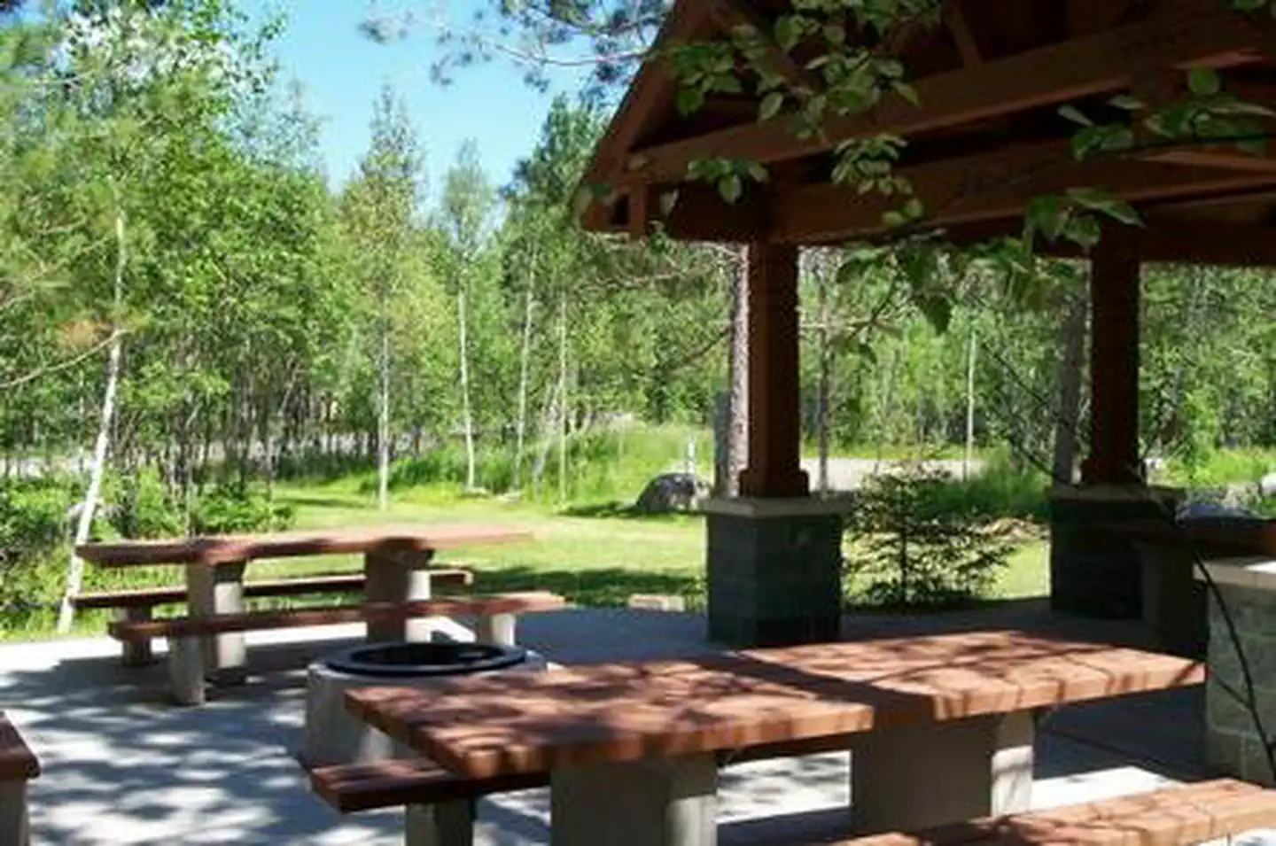 Picture of group site picnic shelter and tables.
