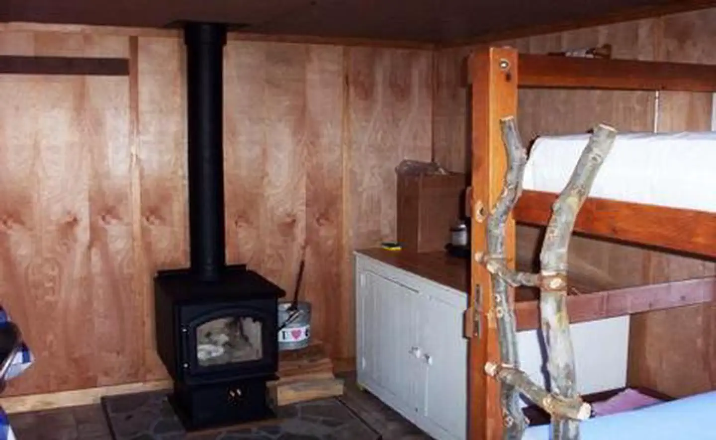 BUCK PARK CABIN - interior showing stove and bunk beds